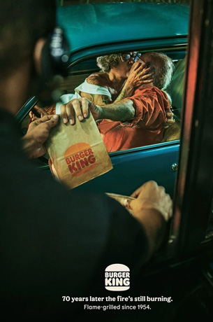Drive thru at Burger King with elderly people kissing like teenageres